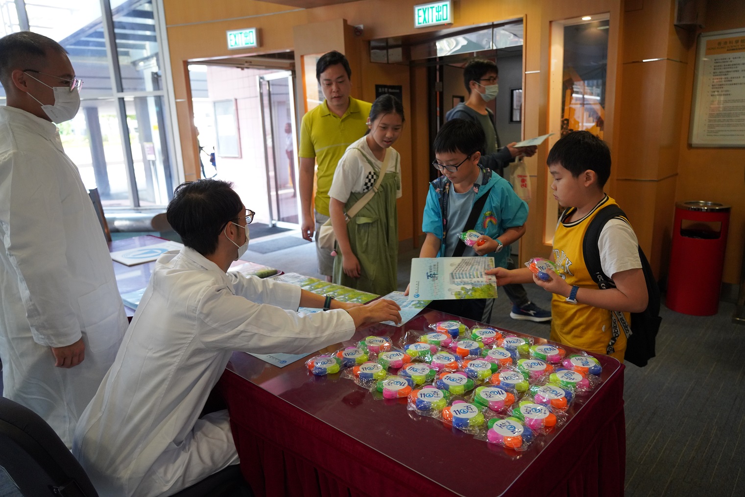 Participants received event souvenirs at the reception area.