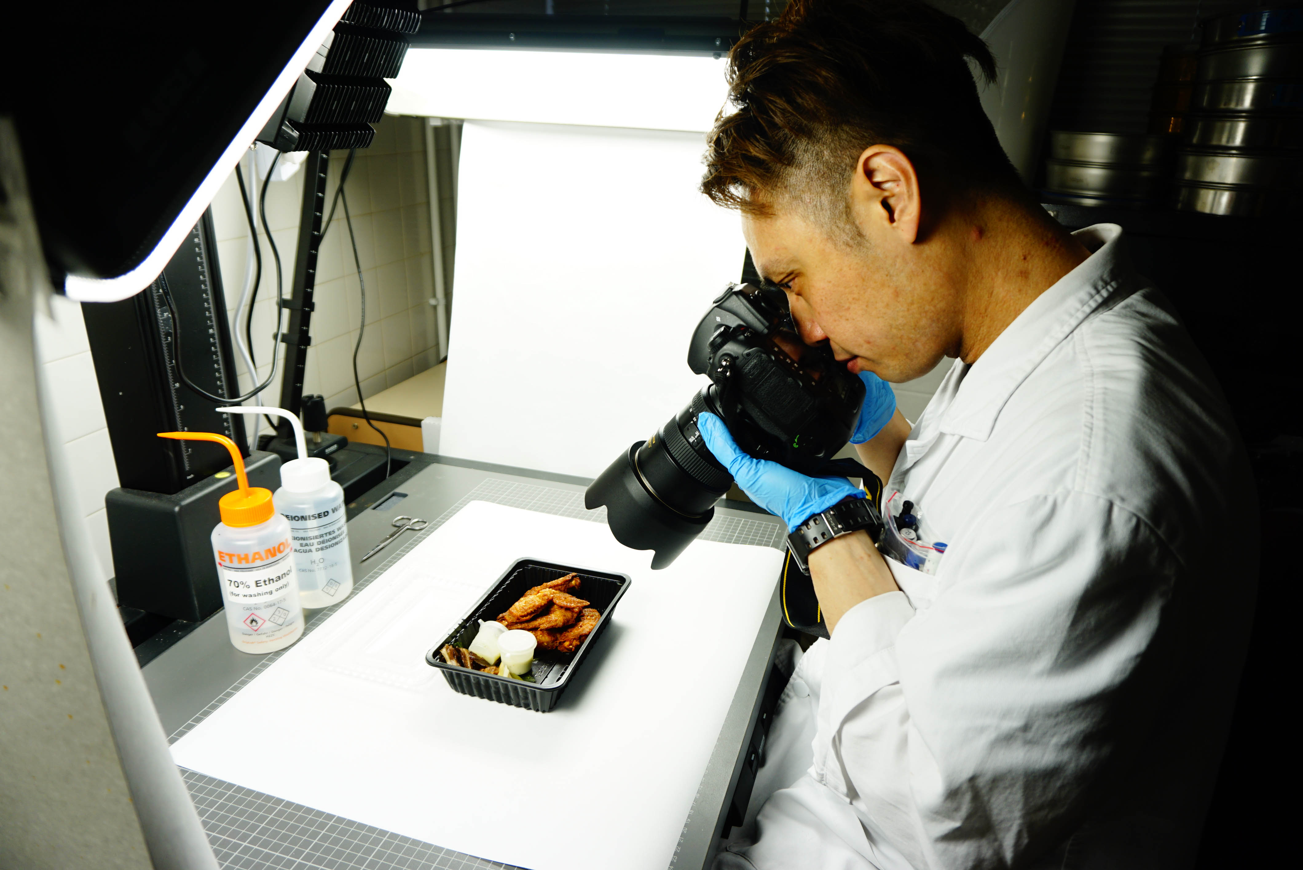 A staff is taking photos from a sample