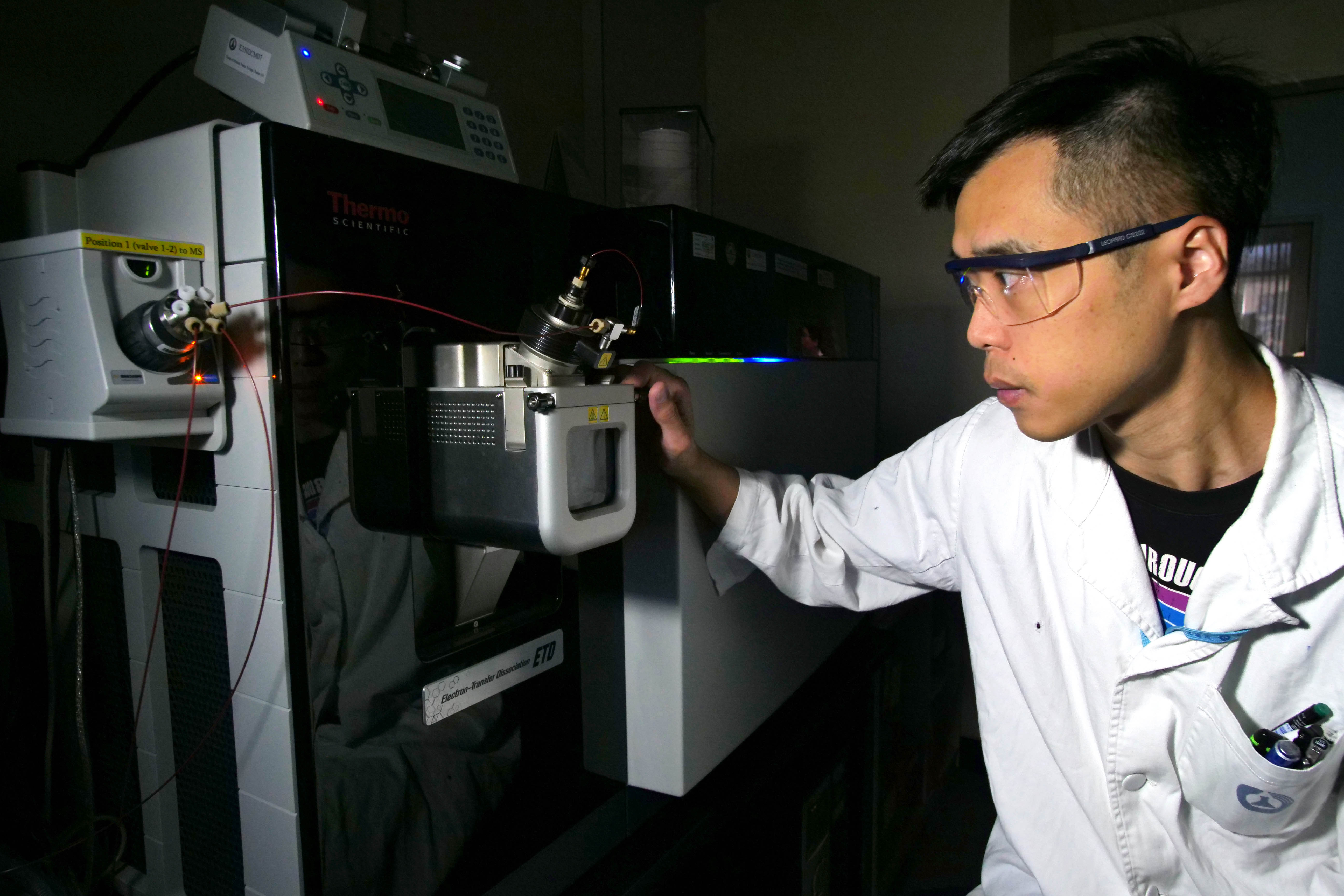 A staff is operating the High Performance Liquid Chromatograph - Quadrupole - Linear Ion Trap - Orbitrap Tribrid Mass Spectrometer to identify the chemical markers in proprietary Chinese medicines